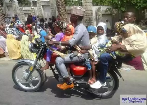 Dangerous ride! Man seen carrying 6 children and another man on a bike in Kano